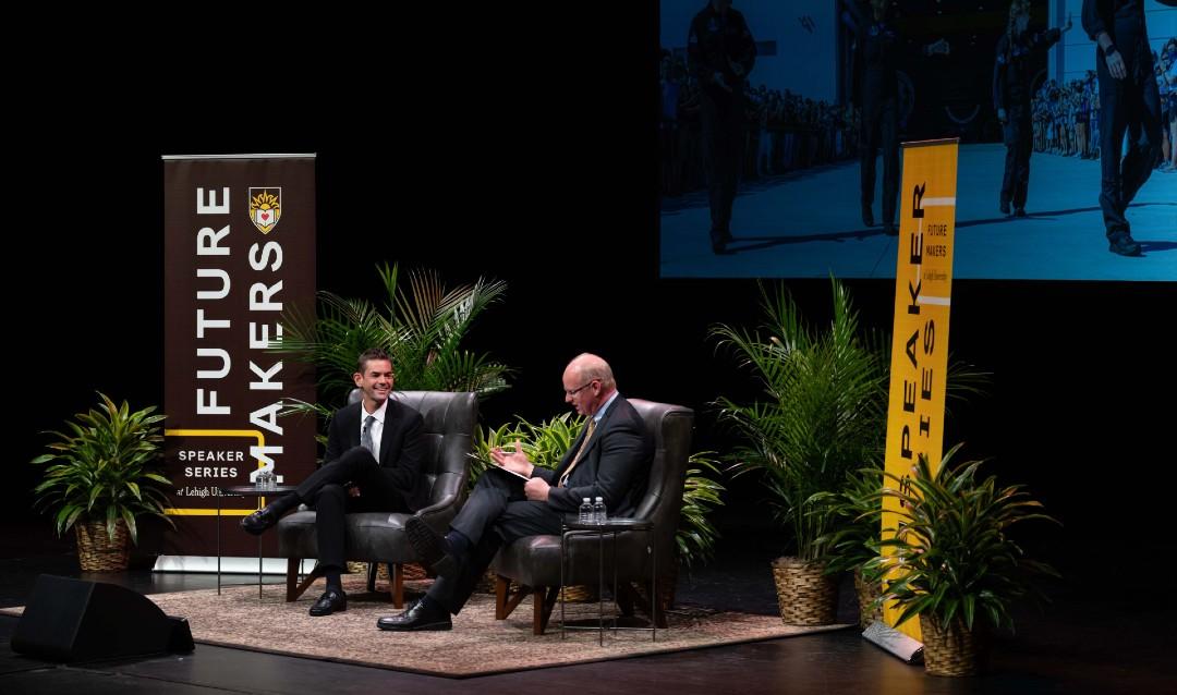 Jared Isaacman with Provost Nathan Urban on stage