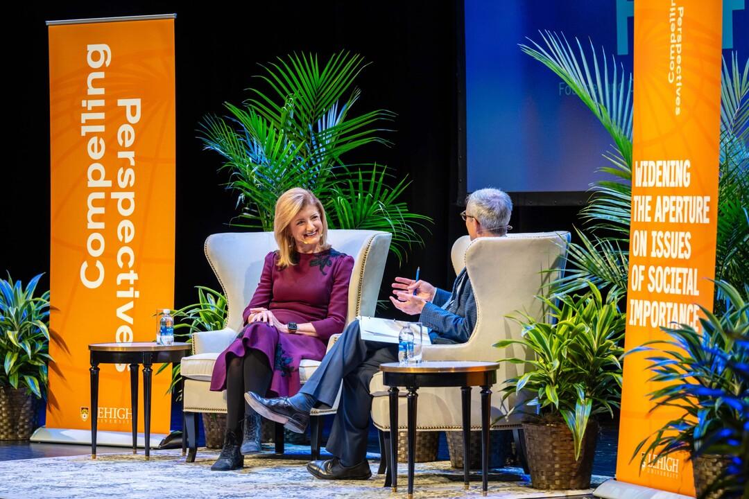 Arianna Huffington and Lehigh University President Joseph J. Helble speak on a university stage during the Compelling Perspectives event series.