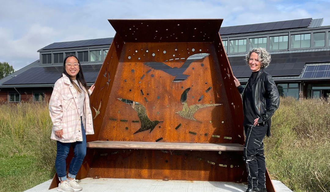 Katie Bui and Deirdre Murphy stand by the Flyways installation at Washington College in Maryland. 