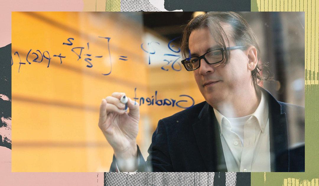 Research professor writing on a clear board