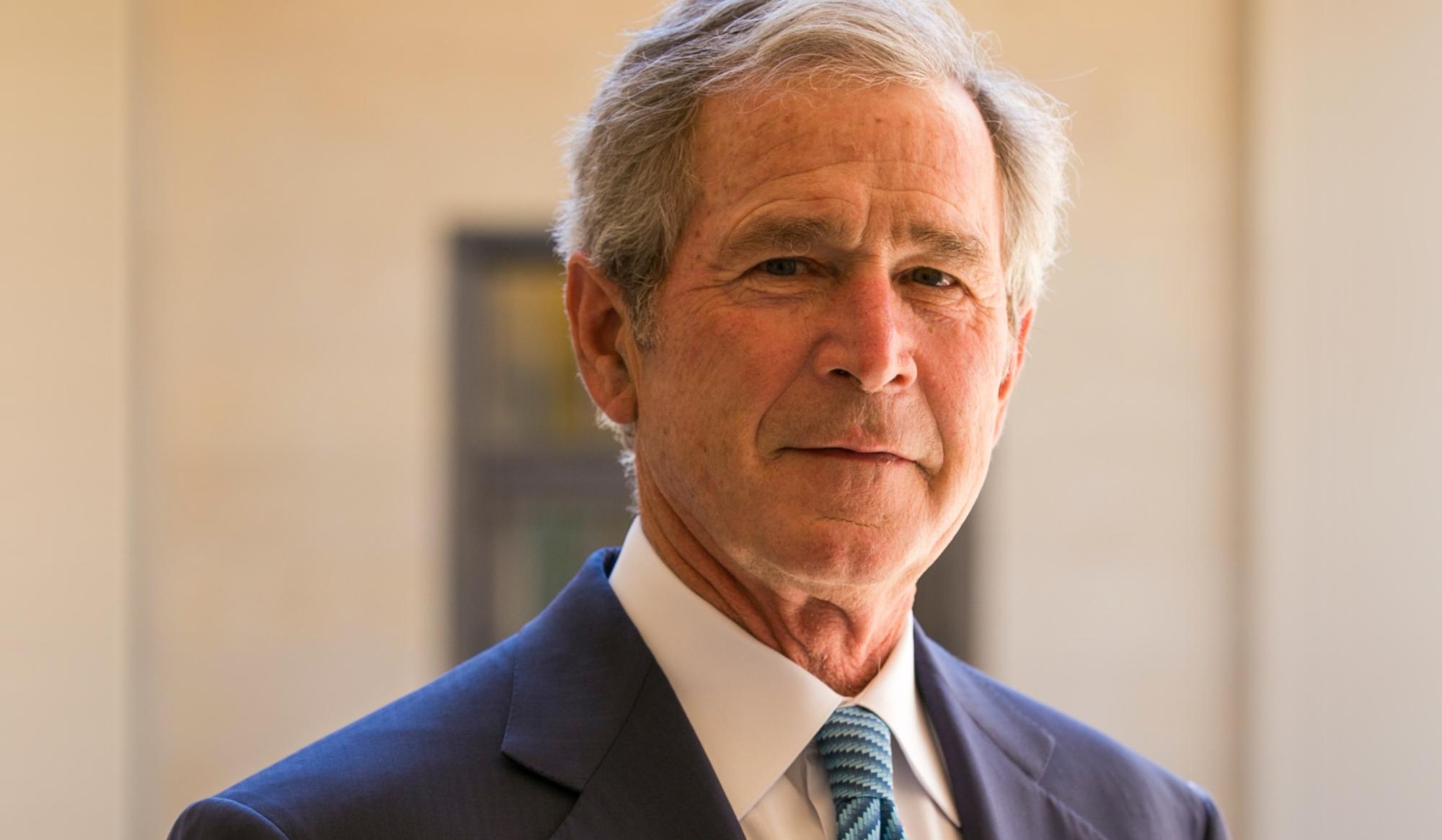 Photograph of George W. Bush wearing a suit and tie.