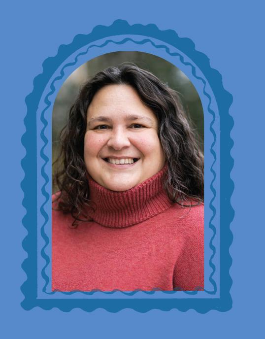 Photograph of a smiling woman in a red turtleneck, framed by a blue scalloped arch.