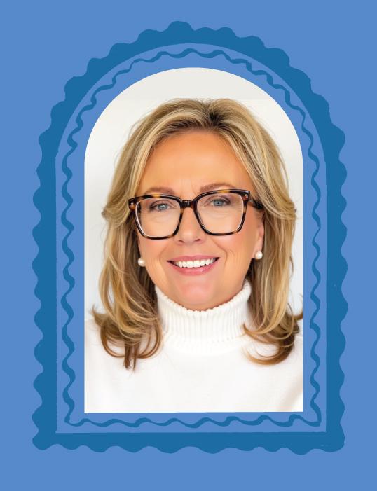 Smiling woman with blonde hair and glasses, framed by a blue scalloped arch.