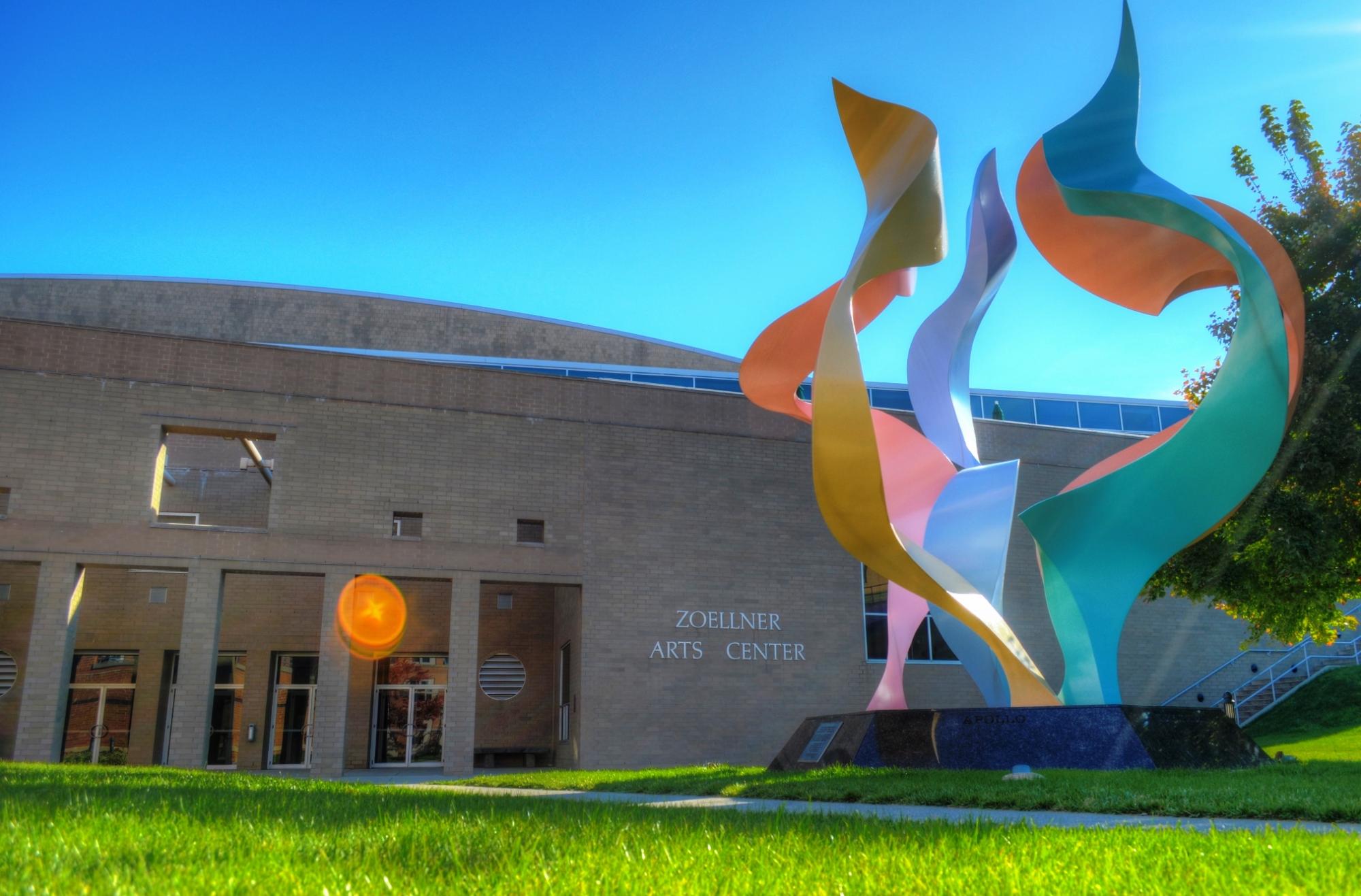 Photograph of a colorful abstract sculpture in front of the Phoenix Arts Center.