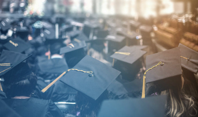 Graduates_in_cap_and_gown_iStock-TheaDesign_