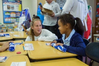 Lehigh_scholar_athlete_with_student_donate_umbrellas_to_tackle_absenteeism_at_local_elementary_school_