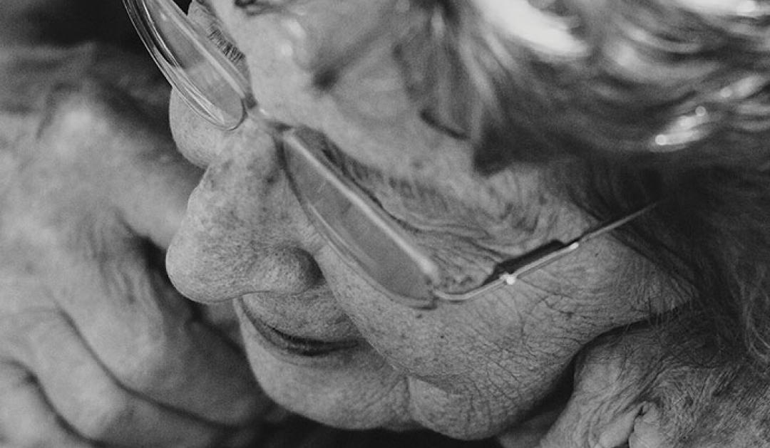 Elderly woman with glasses