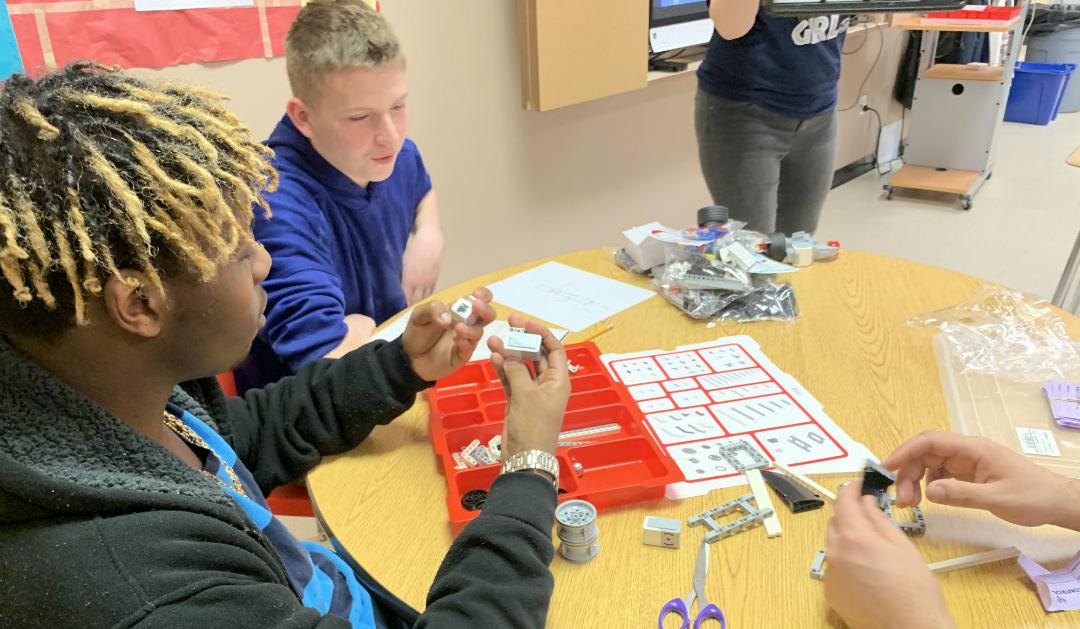 Students at Centennial School of Lehigh University organize the EV3 Mindstorm set materials.