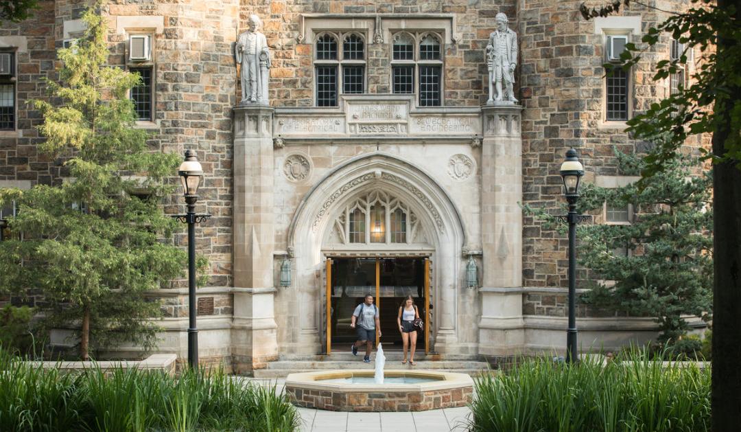Students walk outside of Lehigh University's Packard Lab
