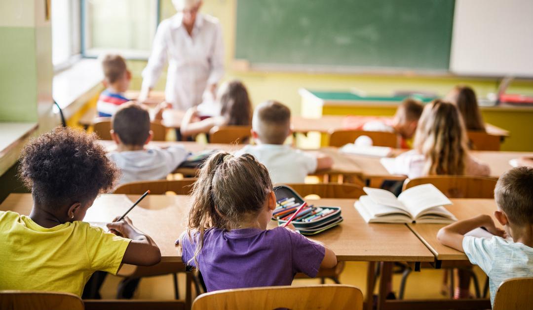 Children work in a classroom