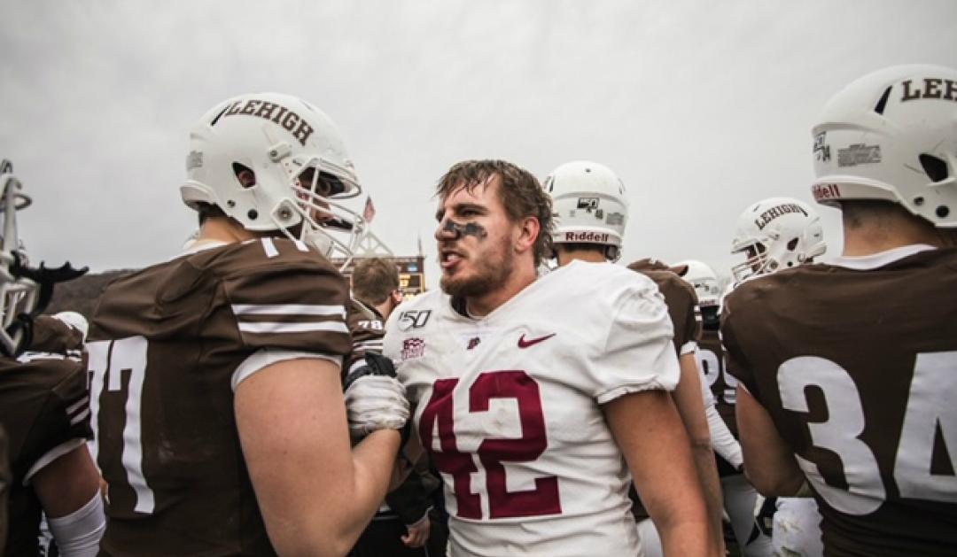 Lehigh offensive lineman Jack Kempsey greeting Lafayette linebacker Major Jordan