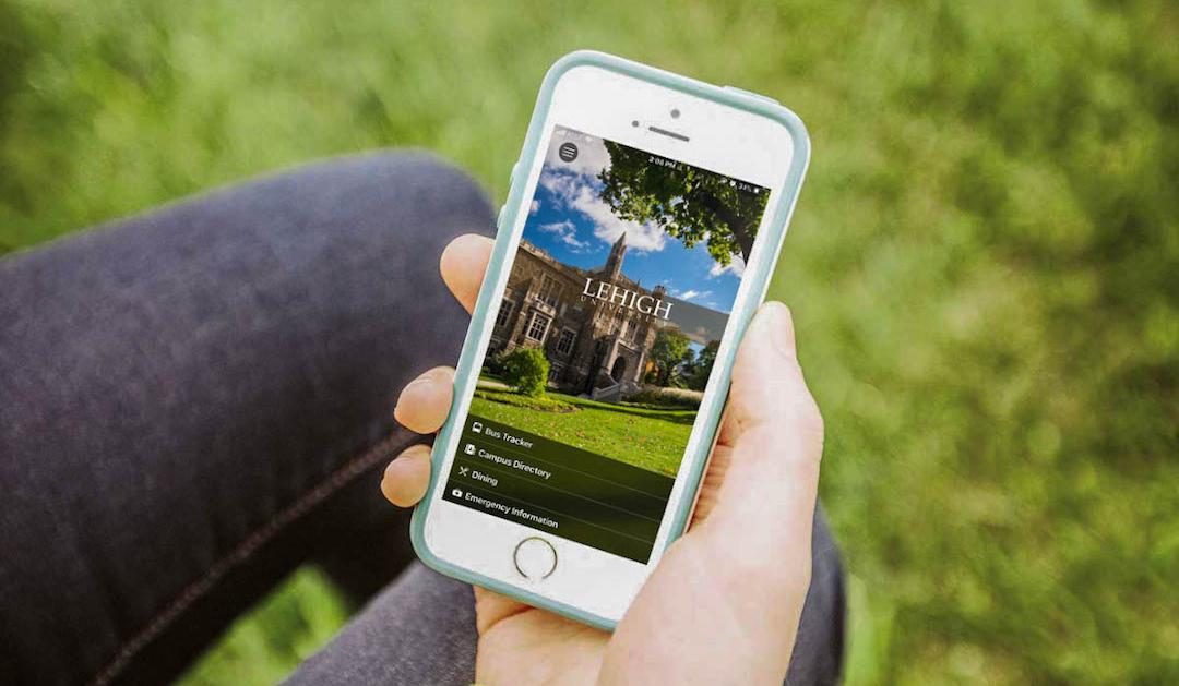 Image of hand holding a smartphone displaying Lehigh University's mobile app