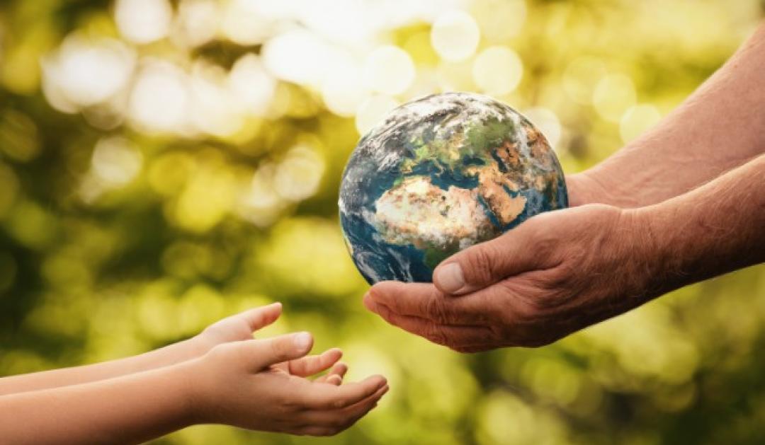 stock image of a person holding a globe
