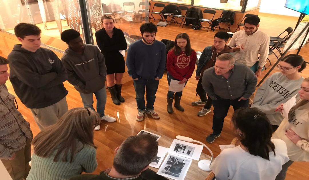 Lehigh students analyzing photographs in spring 2020 as they co-curate the upcoming exhibition Doing Democracy: Photography from the George Stephanopoulos Collection.