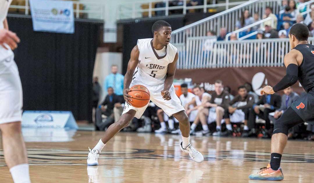 Austin Price playing basketball at Lehigh