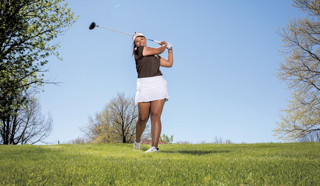 Hannah Foster swinging a golf club