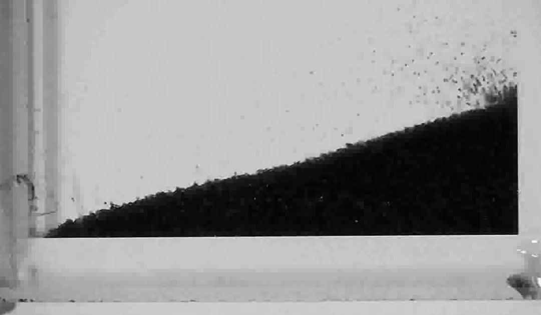 Still image of grains of sand flowing uphill