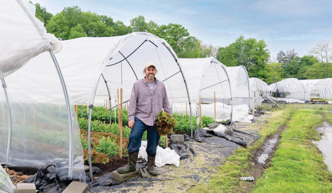 Matt Salvaterra in front of one of the tunnels at his gardens