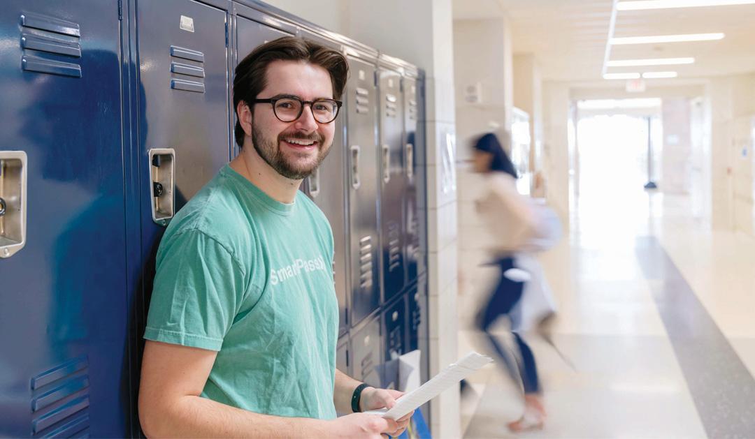 Peter Luba in school hallway near lockers.