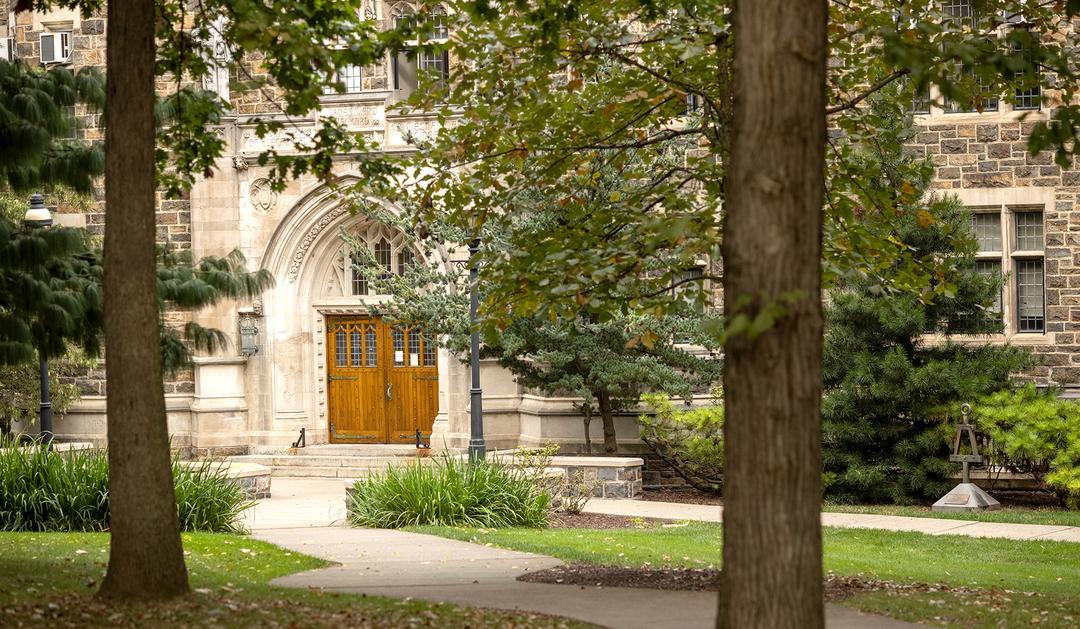 Historical building threshold surrounded by trees