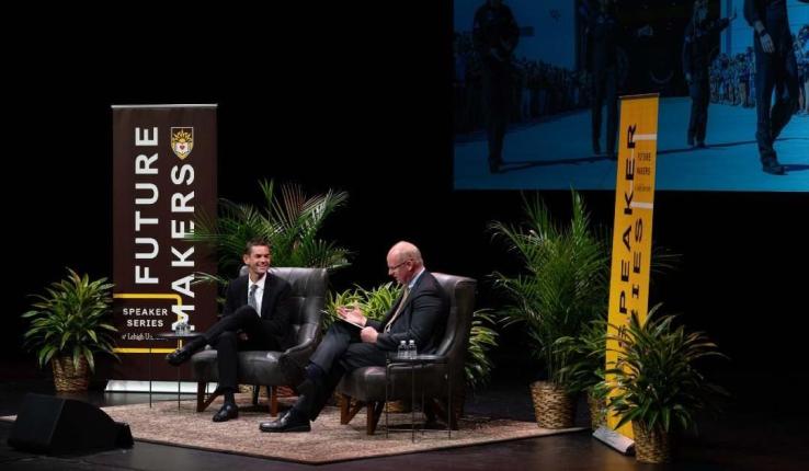 Jared Isaacman with Provost Nathan Urban on stage