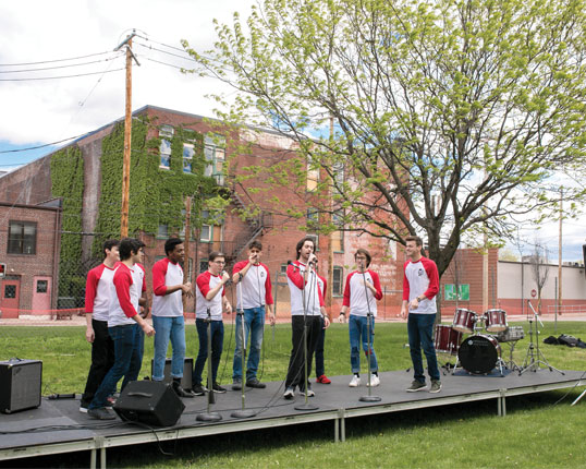 Students singing on stage