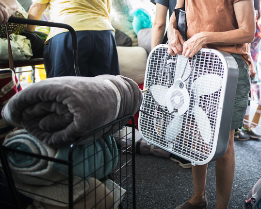 Person holding a fan at the Great South Side Sale