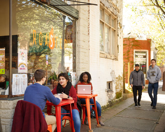 People eating outside a restaurant