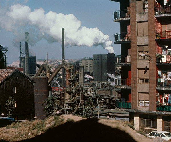 Smoke coming from a factory smokestack