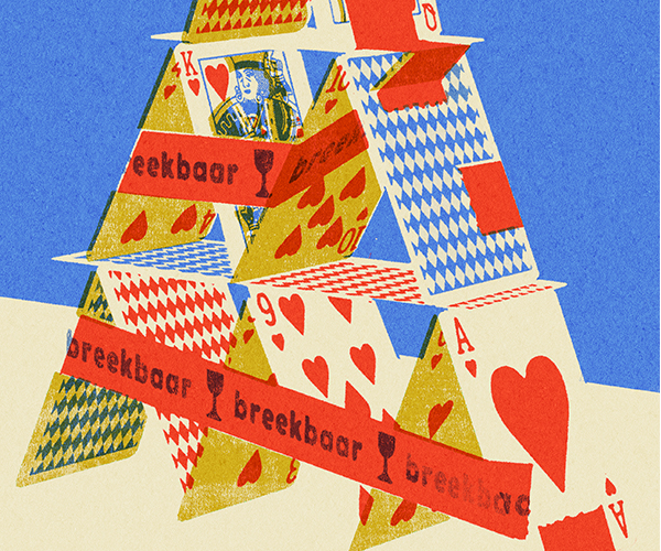 Playing cards stacked in a pyramid