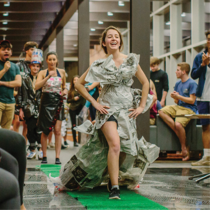 Student in newspaper dress